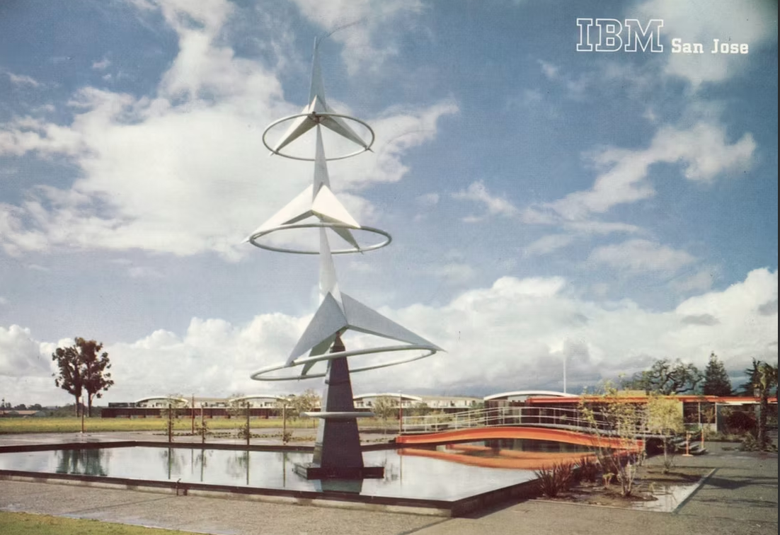 Archival IBM San Jose courtyard image with a geometric tower sculpture.